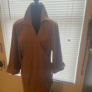 Tan plus size wrap dress. Polyester and spandex. Great for the fall/winter.